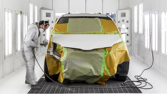 Collision Center Technician Painting a Vehicle | Andy Mohr Toyota in Avon IN
